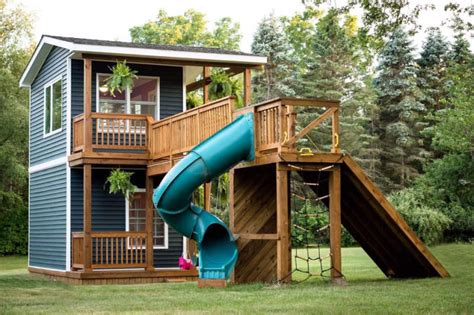 Michigan dad builds two-story playhouse complete with climbing wall and slide