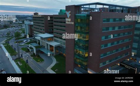 West Virginia University WVU Medicine. Hospital building at night with Stock Video Footage - Alamy