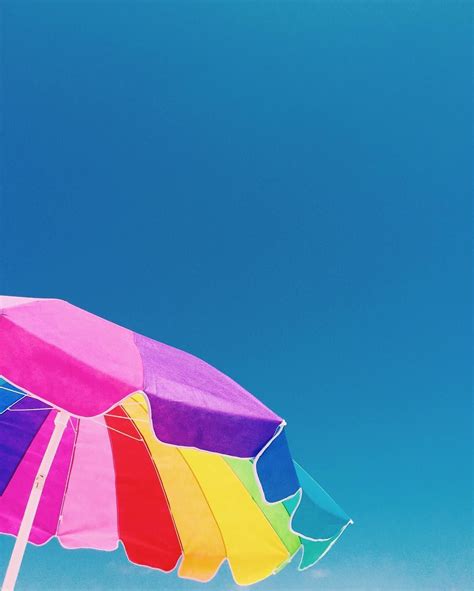 Everybody loves a large colorful beach umbrella | Beach umbrella, Umbrella, Beach