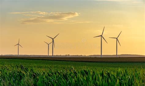 Wind Turbines or Windmills at a Field - Sunset Scene Stock Image - Image of windmill, farm ...