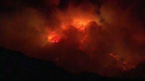 Smoke and flames from wildfire rise into night sky | cbs8.com