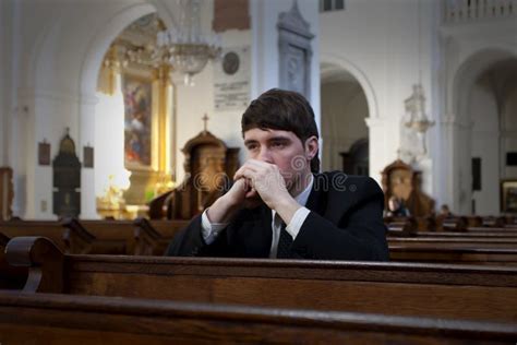 Young Man Praying in Church Stock Photo - Image of ceremony, belive ...