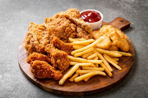 Premium Photo | Fried chicken with french fries and nuggets meal