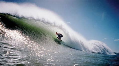 Surfing a tube at Fitzroy Beach, Taranaki | New zealand beach, Taranaki, New plymouth new zealand