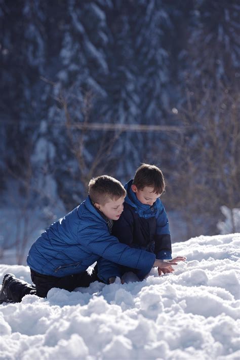 kids playing with fresh snow 11591473 Stock Photo at Vecteezy