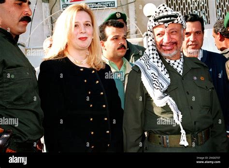 Yasser Arafat, chairman of Palestine Liberation Organization, right ...