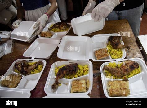 Cairo, Egypt. 19th Apr, 2023. Volunteers of the Egyptian Food Bank prepare food boxes for Iftar ...