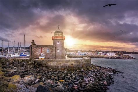 Howth Lighthouse at beautiful sunset Photograph by Dawid Kalisinski ...