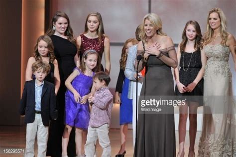 Rory Kennedy speaks onstage with family in background at the 22nd ...