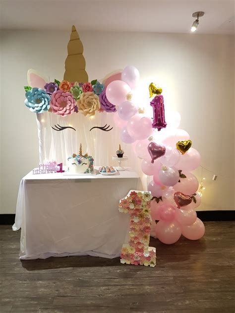 Unicorn set-up for a sweet first birthday party | First birthday party ...