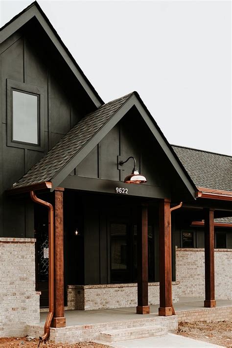 Modern Farmhouse Exterior with Black Board and Batten Siding