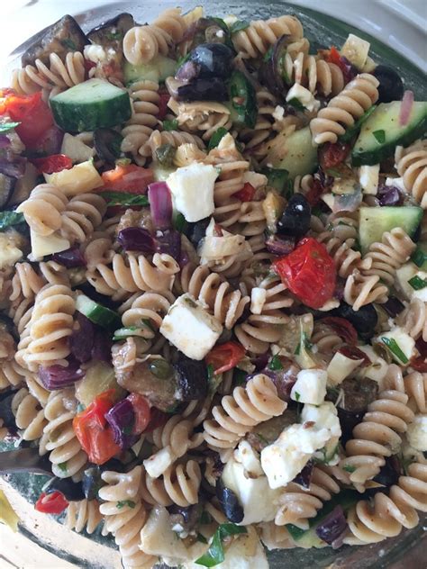 Aubergine and Pasta salad with olives, artichokes and feta cheese in a Mediterranean dressing ...