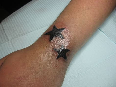 3 Black Stars Tattoo - Photo 1