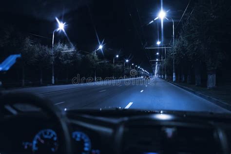 A View from Inside the Car Driving at Night in the City Traffic Highway ...