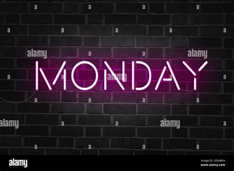 Monday purple neon sign on brick wall Stock Photo - Alamy