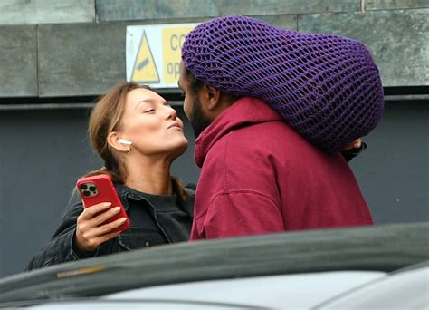 Strictly's Jowita Przystal gives Hamza Yassin a kiss on the cheek as they arrive at rehearsals ...