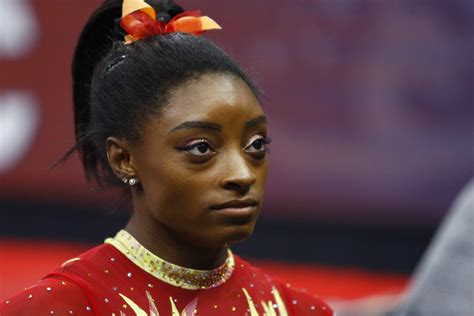 Simone Biles 'aches' for victims after brother charged in triple murder ...