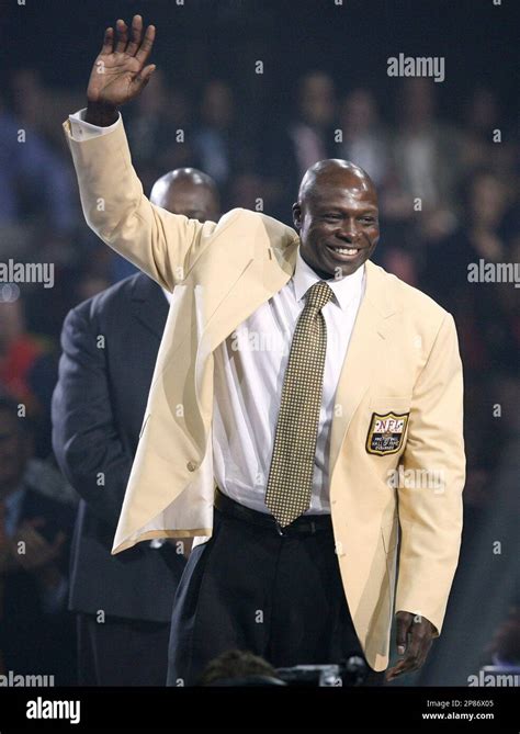 Pro Football Hall of Fame 2009 enshrinee Bruce Smith waves to the crowd ...