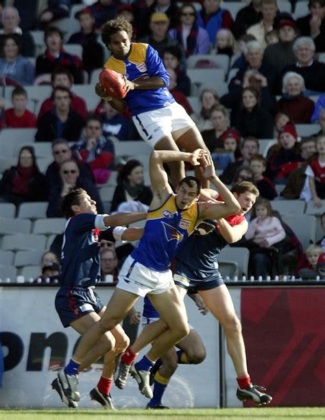 Australian Football League West Coast Eagles v Melbourne at the MCG Ashley Sampi takes one of ...