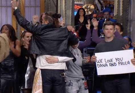 Colin Jost holds up sign for Dana Carvey on 'SNL'