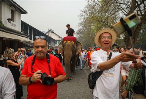 Laos celebrates new year in full tilt with pandemic precautions aside