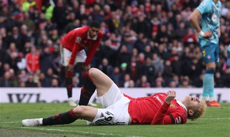 Alejandro Garnacho pictured in walking boot leaving Old Trafford