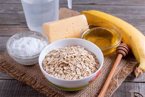 Cooking Oatmeal Porridge. Ingredients on a Wooden Table Stock Image ...