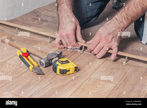 Self-installation of interior floor threshold Stock Photo - Alamy