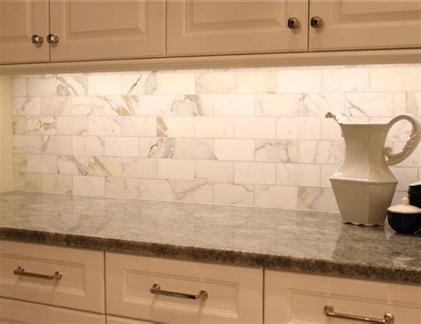 Calcutta Gold marble backsplash. Do this behind stove instead of linear mosaic o… | Marble ...