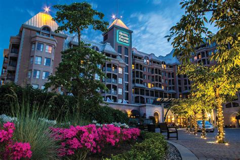 Exterior of hotel at night with trees