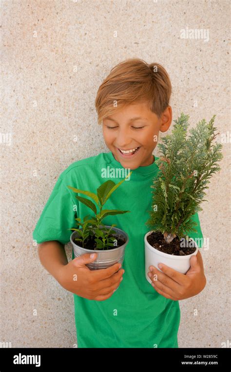 Holding two pots hi-res stock photography and images - Alamy