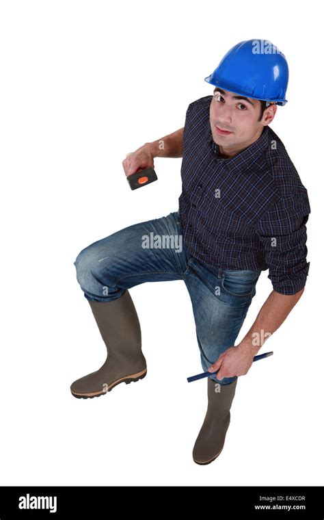 Construction worker in wellington boots Stock Photo - Alamy