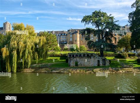 Buildings of old town Le Mans line the River Sarthe in afternoon sun ...