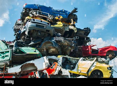 Pile of crushed junk cars on scrapyard Stock Photo - Alamy