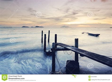 Wooden jetty during sunset stock photo. Image of sunset - 33737804