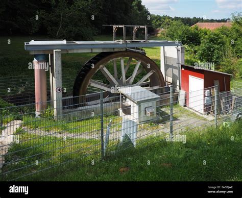 Modern water wheel for electricity production Stock Photo - Alamy