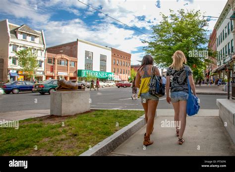 Two students walking on Main Street in Northampton, MA Stock Photo - Alamy