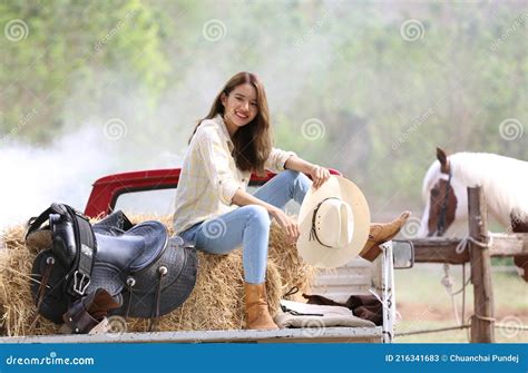 A Woman in a Cowgirl Style Sits in a Horse Ranch with a Western Farm Environment Stock Image ...