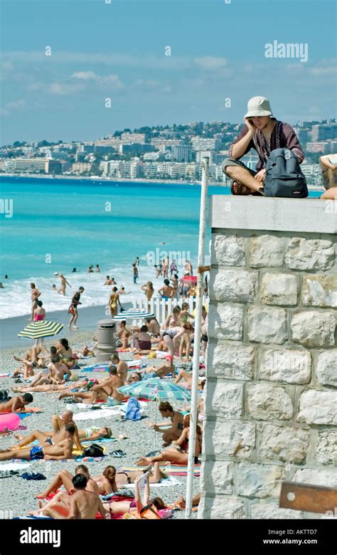 Nice France, Beach Scene Large Crowd People Sunbathing on Beach at ...