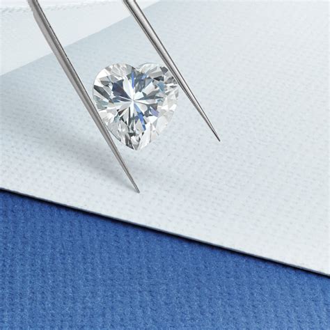 heart shaped diamond in tweezers