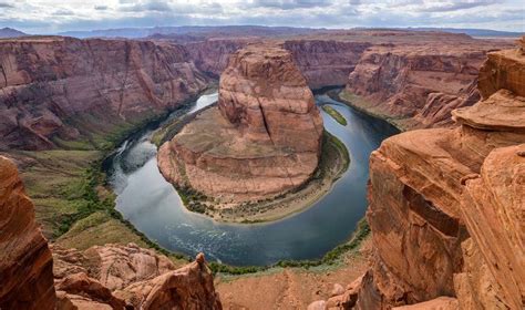 a river flowing through a canyon surrounded by mountains