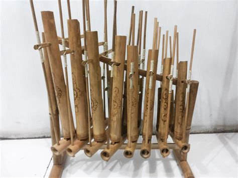 ANGKLUNG (West Java) The angklung is a musical instrument made of two to four bamboo tubes ...