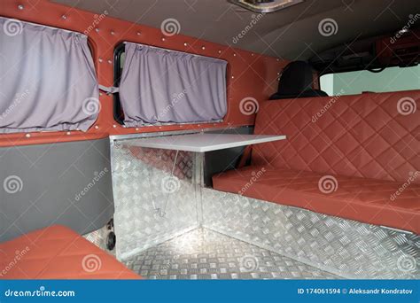 The Interior of the Car in the Back of a Van Converted into a Motor Home for Off-road and Travel ...