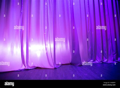 Purple theater curtain and wood floor Stock Photo - Alamy