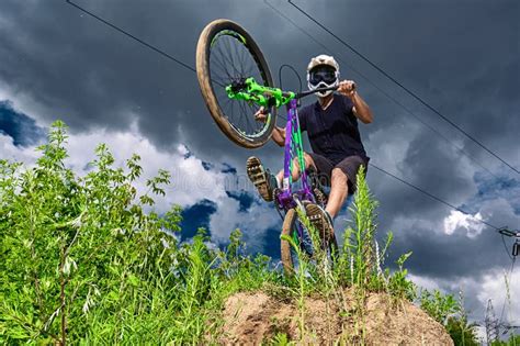 Mountain Bike Cyclist Doing Wheelie Stunt on a Mtb Bike Editorial ...