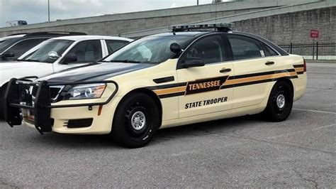 two police cars parked next to each other in a parking lot