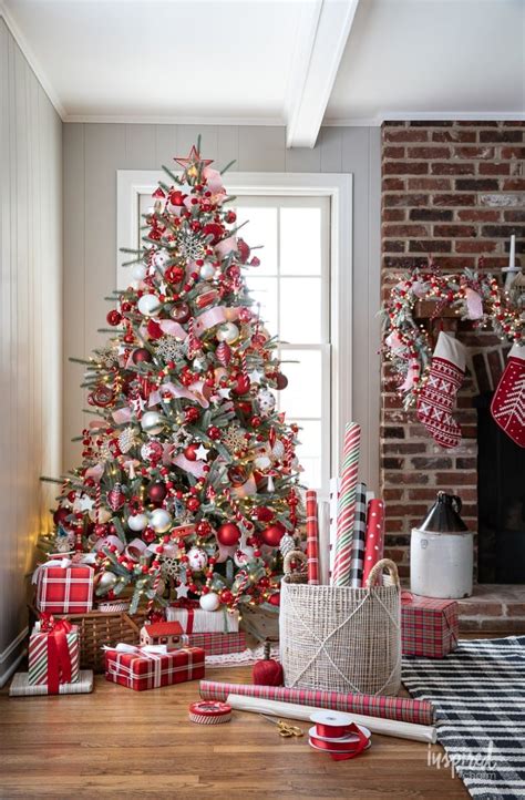 a christmas tree decorated with red, white and silver ornaments