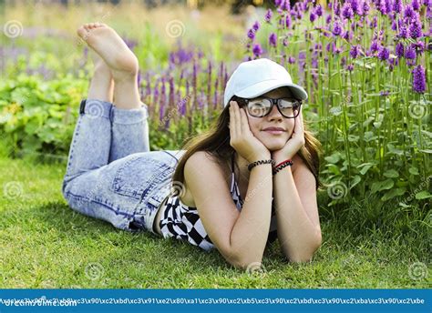 Tween Girl Lying Barefoot Stock