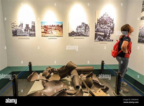 A woman looking at the exhibits inside the War Remnants Museum, a war ...