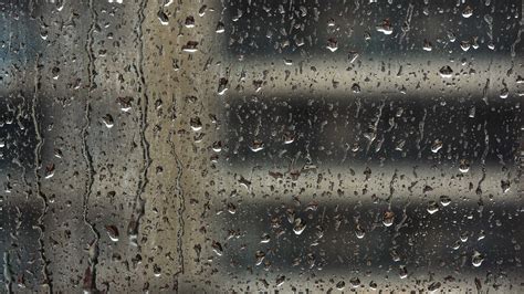 The Rain Drops on Window Glass 34328183 Stock Video at Vecteezy